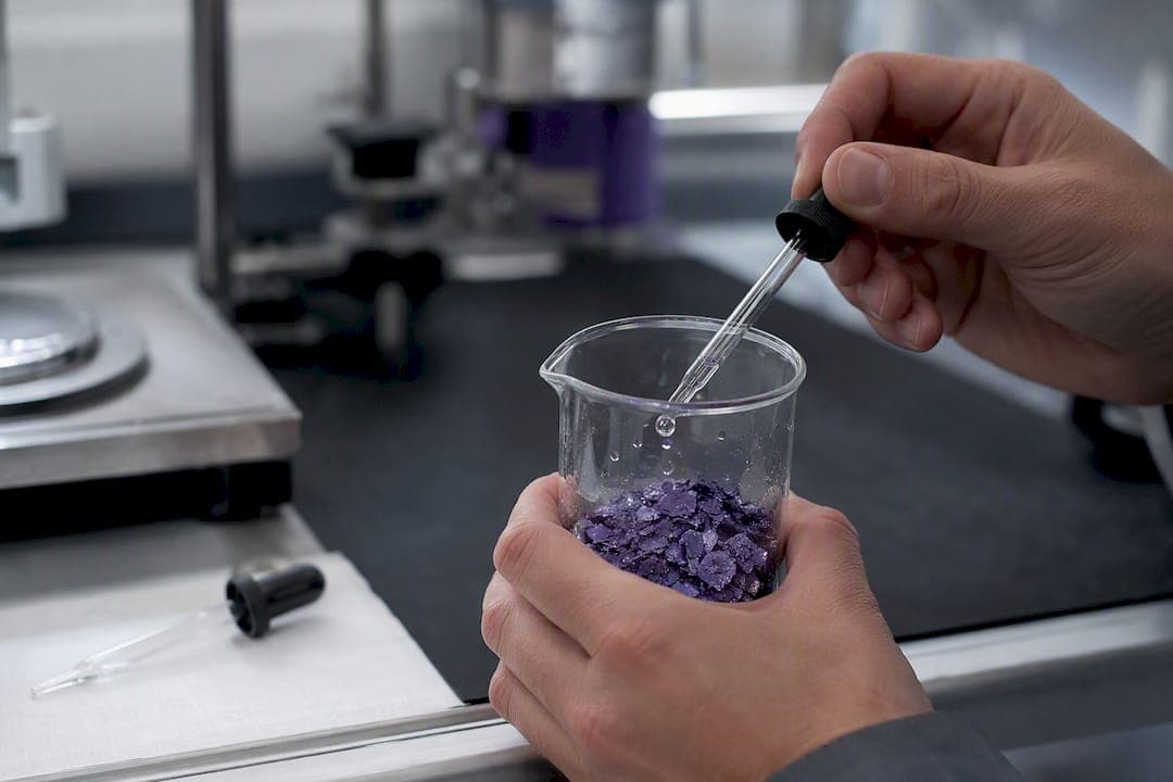 Close-up of pigment flakes being wetted by liquid dispersant