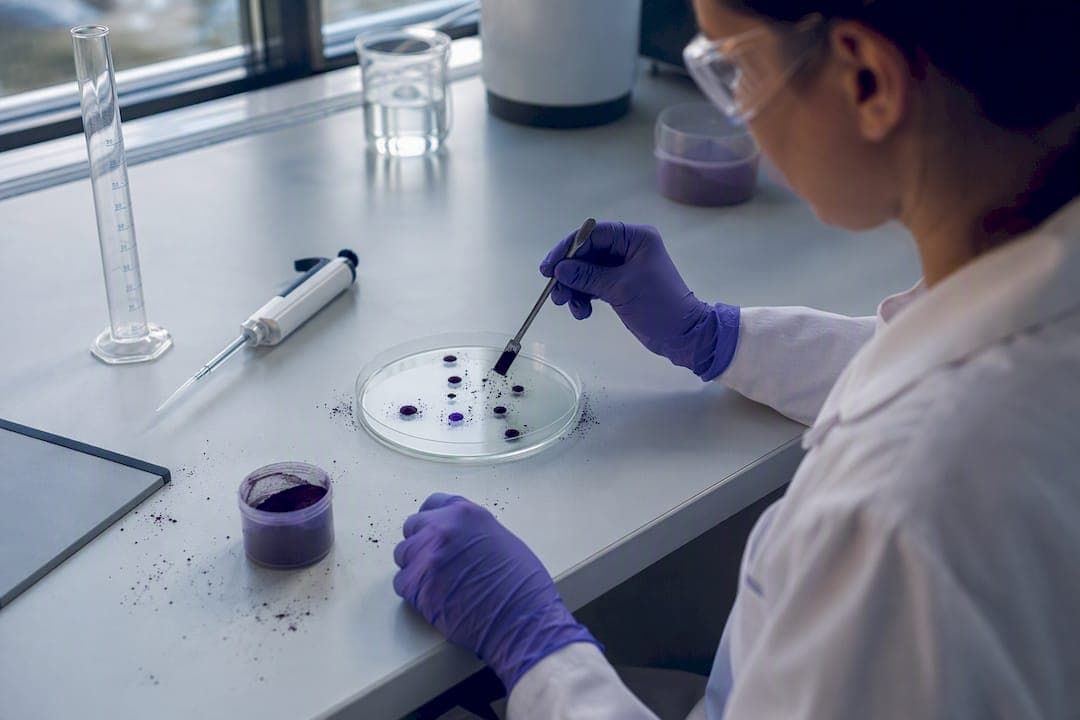 Technician testing pigment wetting in lab